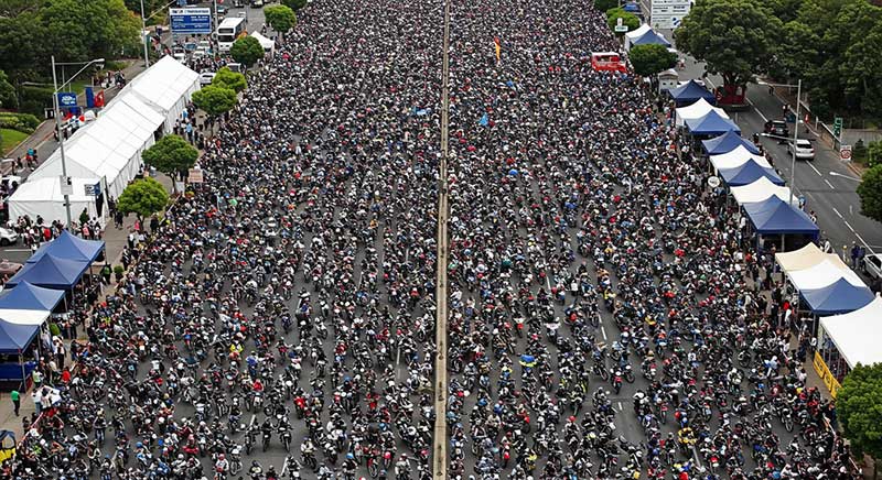 Aerial view of a large motorcycle parade or gathering during ROT Rally